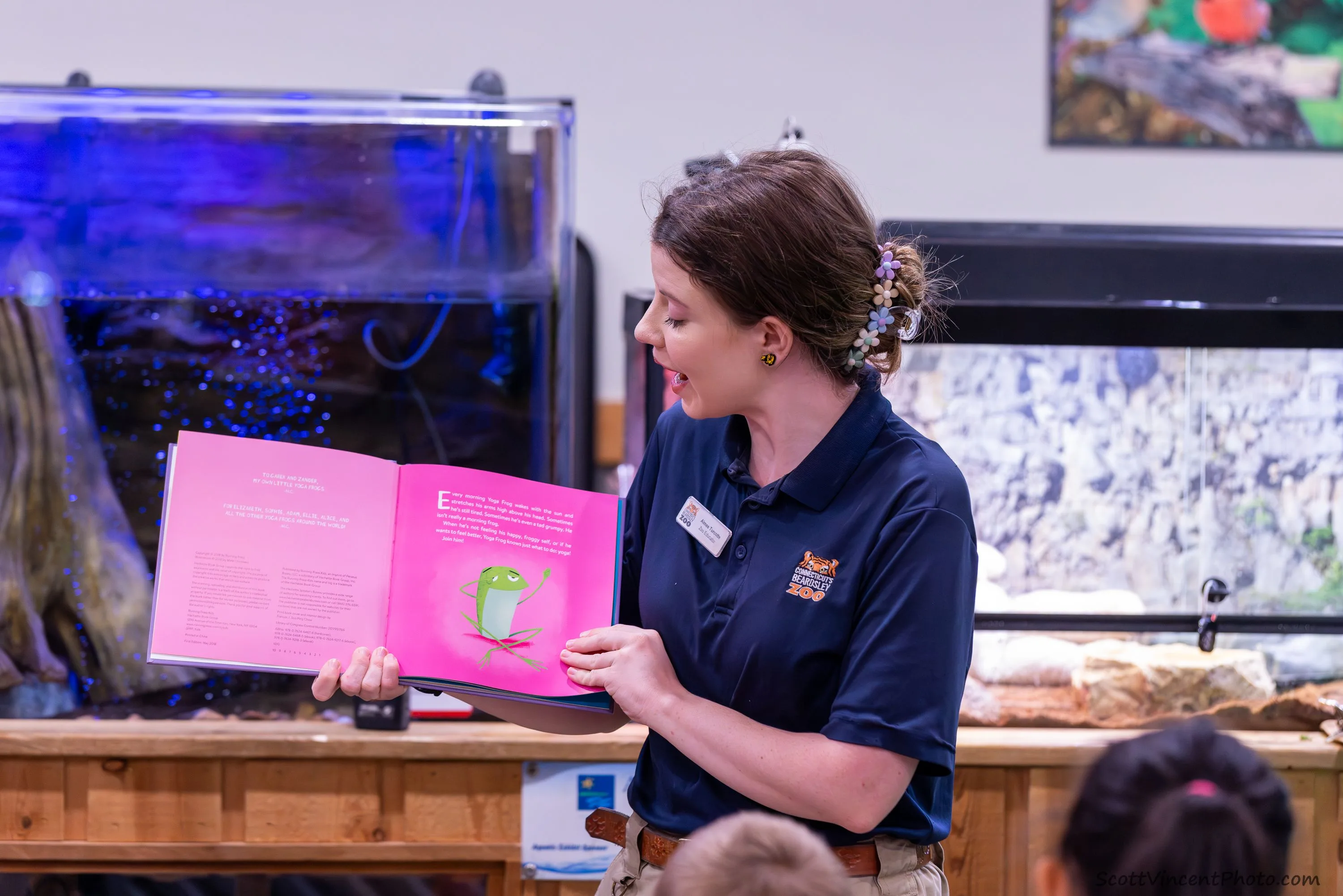 Zoo Educator reading a book to participants.